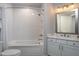 Clean bathroom with a shower/tub combo and white vanity at 1208 Restoration Dr, Durham, NC 27703