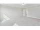 Simple bedroom with large window and carpeted floor at 151 Hanover Dr, Sanford, NC 27330