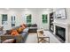 Living room with gray sectional sofa, fireplace, and built-in shelving at 151 Hanover Dr, Sanford, NC 27330