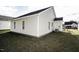 Exterior side view of the house, showcasing vinyl siding and landscaping at 1962 Sapphire Rd, Rocky Mount, NC 27804