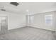 Spacious bedroom with gray carpeting, white walls, and several windows at 314 White Birch Ln, Angier, NC 27501