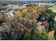 Aerial view showcasing home's wooded setting and neighborhood at 318 Rawls Church Rd, Angier, NC 27501