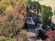 Aerial view of house and surrounding land with autumn colors at 318 Rawls Church Rd, Angier, NC 27501