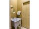 Small bathroom with utility sink and door at 318 Rawls Church Rd, Angier, NC 27501