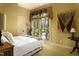 Bright bedroom with a comfortable bed, large window, and wood flooring at 318 Rawls Church Rd, Angier, NC 27501