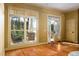 Bright entryway with hardwood floors and view of porch at 318 Rawls Church Rd, Angier, NC 27501