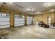 Spacious three-car garage with high ceilings and ample storage space at 318 Rawls Church Rd, Angier, NC 27501