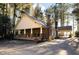 Ranch-style home with covered porch and driveway at 318 Rawls Church Rd, Angier, NC 27501
