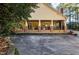 Back of house with covered porch and brick accents at 318 Rawls Church Rd, Angier, NC 27501