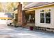 Side view of house with covered porch and garage at 318 Rawls Church Rd, Angier, NC 27501