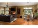 Living room with a fireplace, built-in shelving, and hardwood floors at 318 Rawls Church Rd, Angier, NC 27501