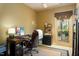 Home office with a large desk, comfortable chair, and natural light at 318 Rawls Church Rd, Angier, NC 27501