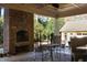 Brick fireplace and seating area on the patio at 318 Rawls Church Rd, Angier, NC 27501