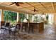 Covered patio with outdoor kitchen and seating area at 318 Rawls Church Rd, Angier, NC 27501