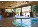 Outdoor oasis with a spa, built-in kitchen, and covered patio at 318 Rawls Church Rd, Angier, NC 27501