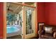 Relaxing view of the pool and patio through French doors at 318 Rawls Church Rd, Angier, NC 27501