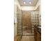 Walk-in shower with glass block walls and tiled flooring at 318 Rawls Church Rd, Angier, NC 27501