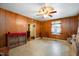 Dining area with wood paneling and a ceiling fan at 511 Elmira Ave, Durham, NC 27707