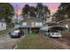 Brick house with carport and balcony, offering curb appeal at 511 Elmira Ave, Durham, NC 27707