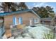 Brick ranch home with a covered patio and blue shutters at 511 Elmira Ave, Durham, NC 27707