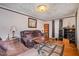Living room features hardwood floors, a cozy seating area, and decorative accents at 511 Elmira Ave, Durham, NC 27707