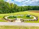 Community playground with play structures and picnic tables at 744 Georgia'S Landing Pkwy # 5, Raleigh, NC 27603
