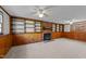 Spacious basement with wood paneling, built-in shelves, and a fireplace at 105 Reton Ct, Cary, NC 27513