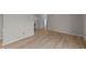 Bright hallway with wood-look floors and access to bedrooms at 105 Reton Ct, Cary, NC 27513