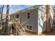 Side view of house showcasing gray siding and brick accents at 105 Reton Ct, Cary, NC 27513