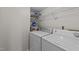 Laundry closet with washer, dryer, and additional shelving at 105 Reton Ct, Cary, NC 27513