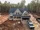 New construction home with a covered front porch and attached two-car garage at 115 Purslane Dr, Franklinton, NC 27525