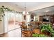 Breakfast nook with glass table and chairs, and access to deck at 128 Chownings Dr, Sanford, NC 27330