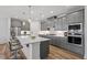 Modern kitchen with gray cabinets, white countertops, and stainless steel appliances at 15 Abundance Ln, Pittsboro, NC 27312