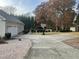 Spacious backyard with a basketball court and detached shed at 15 Madinah Ct, Youngsville, NC 27596