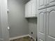 Laundry room with upper and lower cabinets at 15 Madinah Ct, Youngsville, NC 27596