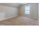 Bright bedroom with neutral walls and carpet at 1519 St Andrews Dr, Mebane, NC 27302