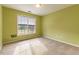 Bedroom with light green walls, carpet, and a large window at 1519 St Andrews Dr, Mebane, NC 27302