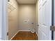 Laundry room with wood flooring and shelving at 1519 St Andrews Dr, Mebane, NC 27302