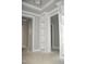 Hallway with built-in shelving and crown molding at 1590 Nc 96 Hwy S, Franklinton, NC 27525