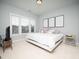 Bright bedroom with a king-size bed and plenty of natural light at 1617 Pasture Hills Dr, Wake Forest, NC 27587