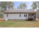 House back view showcasing a screened porch and deck at 20 Shorrey Pl, Youngsville, NC 27596