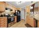 Galley kitchen with stainless steel appliances and wood cabinets at 20 Shorrey Pl, Youngsville, NC 27596