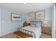 Bedroom with metal bed frame and light blue walls at 2010 Fletchers Ridge Dr, Durham, NC 27703