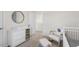 Bedroom with crib, chair, and changing table at 2010 Fletchers Ridge Dr, Durham, NC 27703