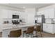 Kitchen island with granite countertop and seating for three at 2010 Fletchers Ridge Dr, Durham, NC 27703