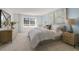 Spacious main bedroom with large window and wood dresser at 2010 Fletchers Ridge Dr, Durham, NC 27703