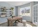 Home office with built-in shelving, large window, and a workspace at 2010 Fletchers Ridge Dr, Durham, NC 27703