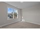 Spacious bedroom with large window, ceiling fan and neutral walls at 22 Laramie Ln, Selma, NC 27576