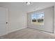 Well-lit bedroom featuring a window overlooking the backyard at 22 Laramie Ln, Selma, NC 27576