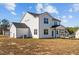 Two-story home with covered patio and grassy yard at 22 Laramie Ln, Selma, NC 27576